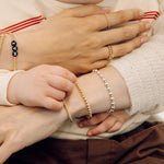 stack of gold bracelets