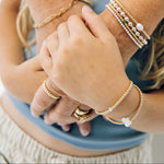 Birthstone bracelets on a granny and granddaughter
