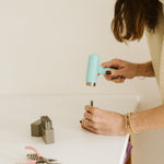 Erinn stamping the disc with an inital 