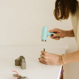 Erinn stamping the disc with an inital 