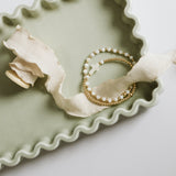 Gold and pearl bracelets with a cross