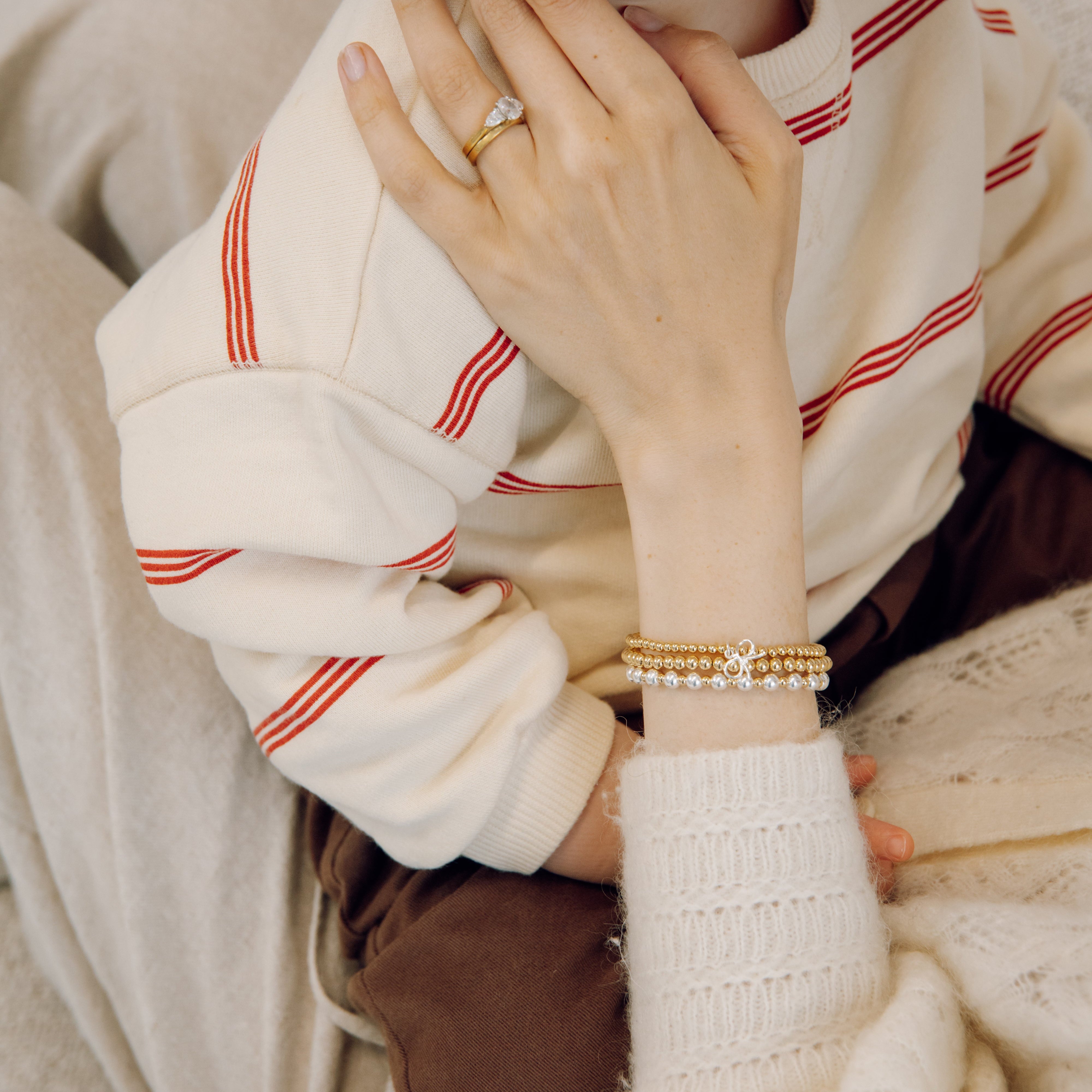 gold bow charm bracelet