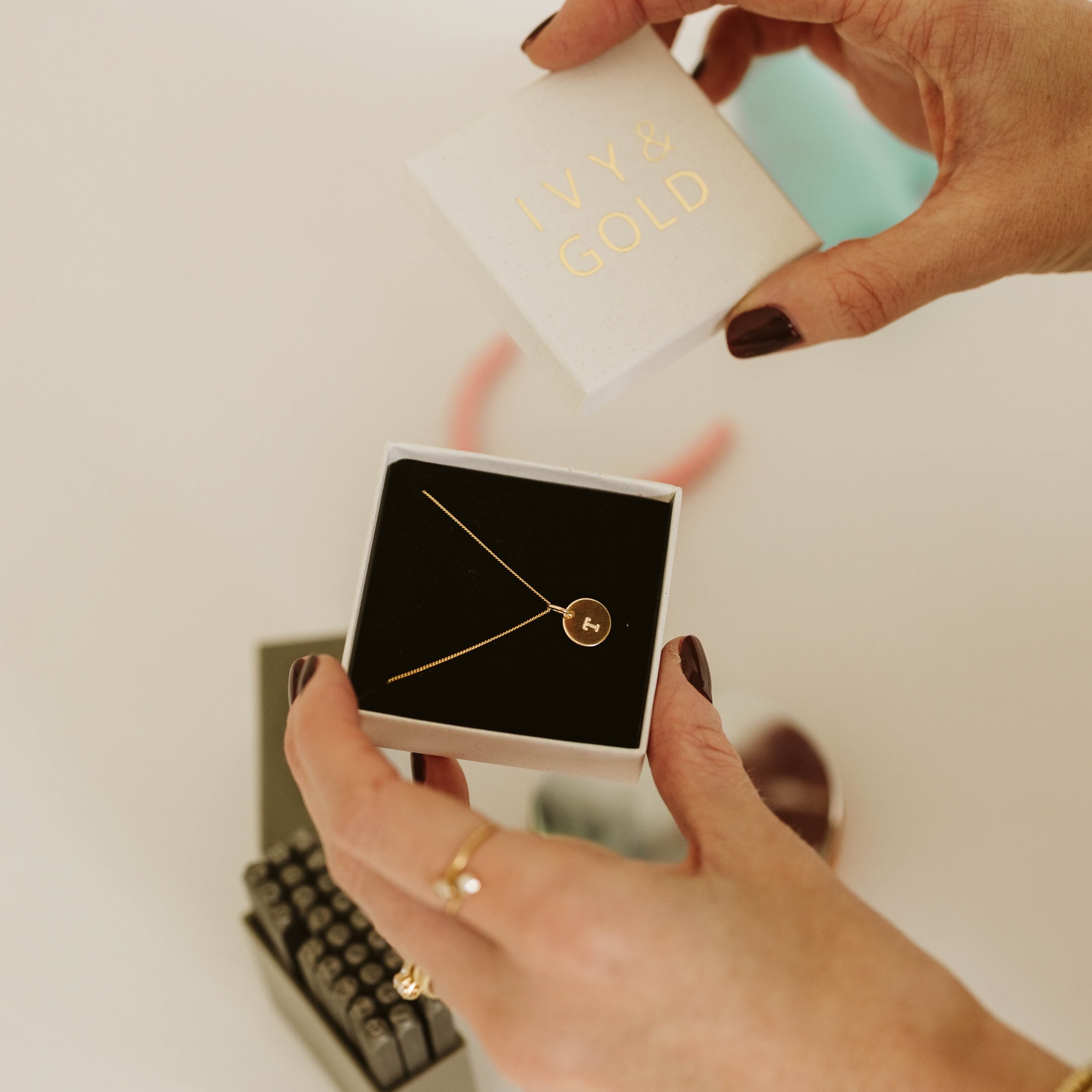 Necklace stamped with initial T