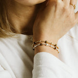 Gold and silver bracelets with tigers eye beads